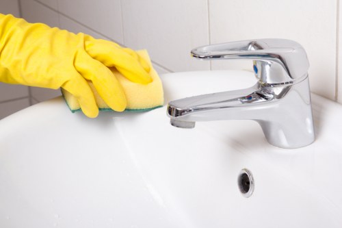 Technician treating sofa fabric during upholstery cleaning in E3